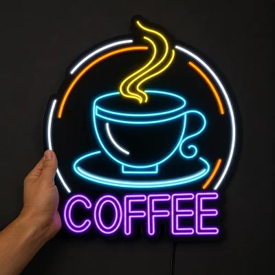تابلو نئون کافه طرح فنجان و بخار و نوشته انگلیسی COFFEE داخل کادر دایره ای از نمای رو به رو